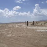 Wide, flat dry lakebed of the Willcox Playa under a cloudy sky in Cochise County, Arizona