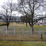 Buildings of the Federal Court of Justice in Karlsruhe behind a fence and bare trees