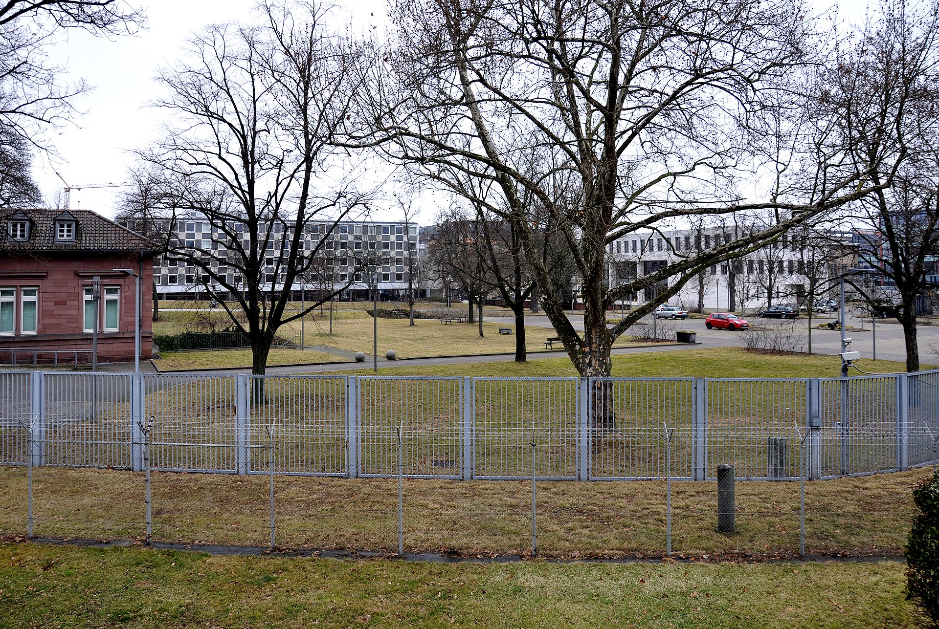 Buildings of the Federal Court of Justice in Karlsruhe behind a fence and bare trees