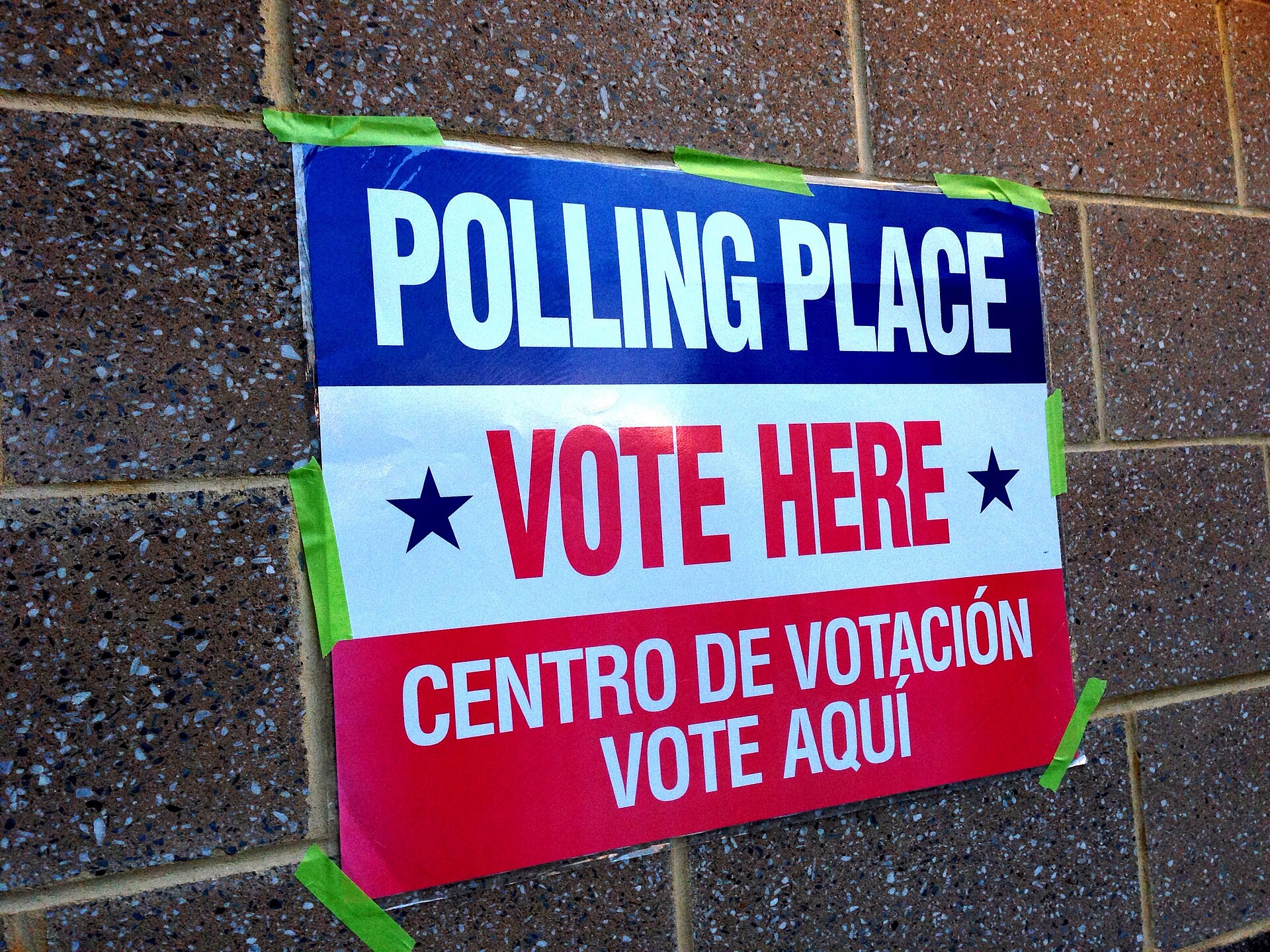 A 'Vote Here' sign at a polling place