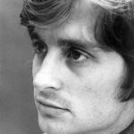 Black-and-white portrait of a young Michael Douglas with tousled hair, 1969