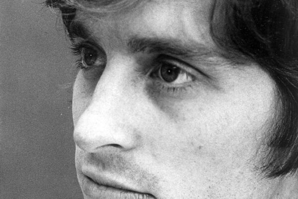 Black-and-white portrait of a young Michael Douglas with tousled hair, 1969