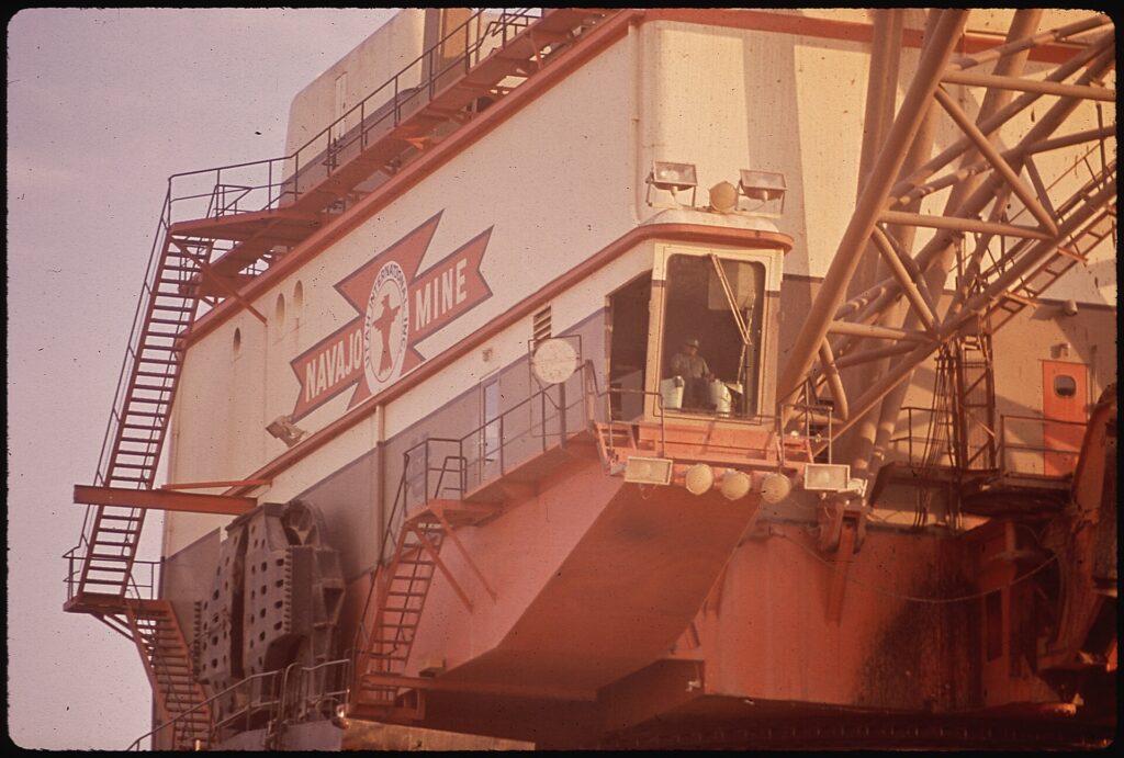 Large industrial dragline machine with stairs and cab at the Navajo coal mine, 1972