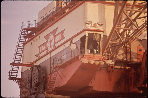 Large industrial dragline machine with stairs and cab at the Navajo coal mine, 1972