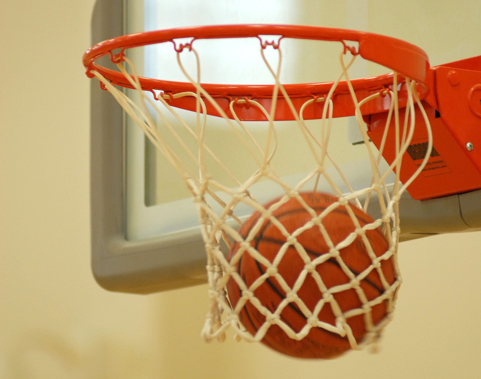 A basketball goes through the hoop