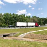 Tractor-trailer driving on an interstate highway