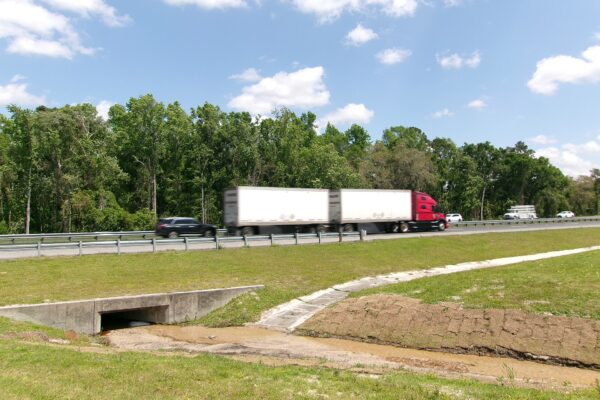 Tractor-trailer driving on an interstate highway