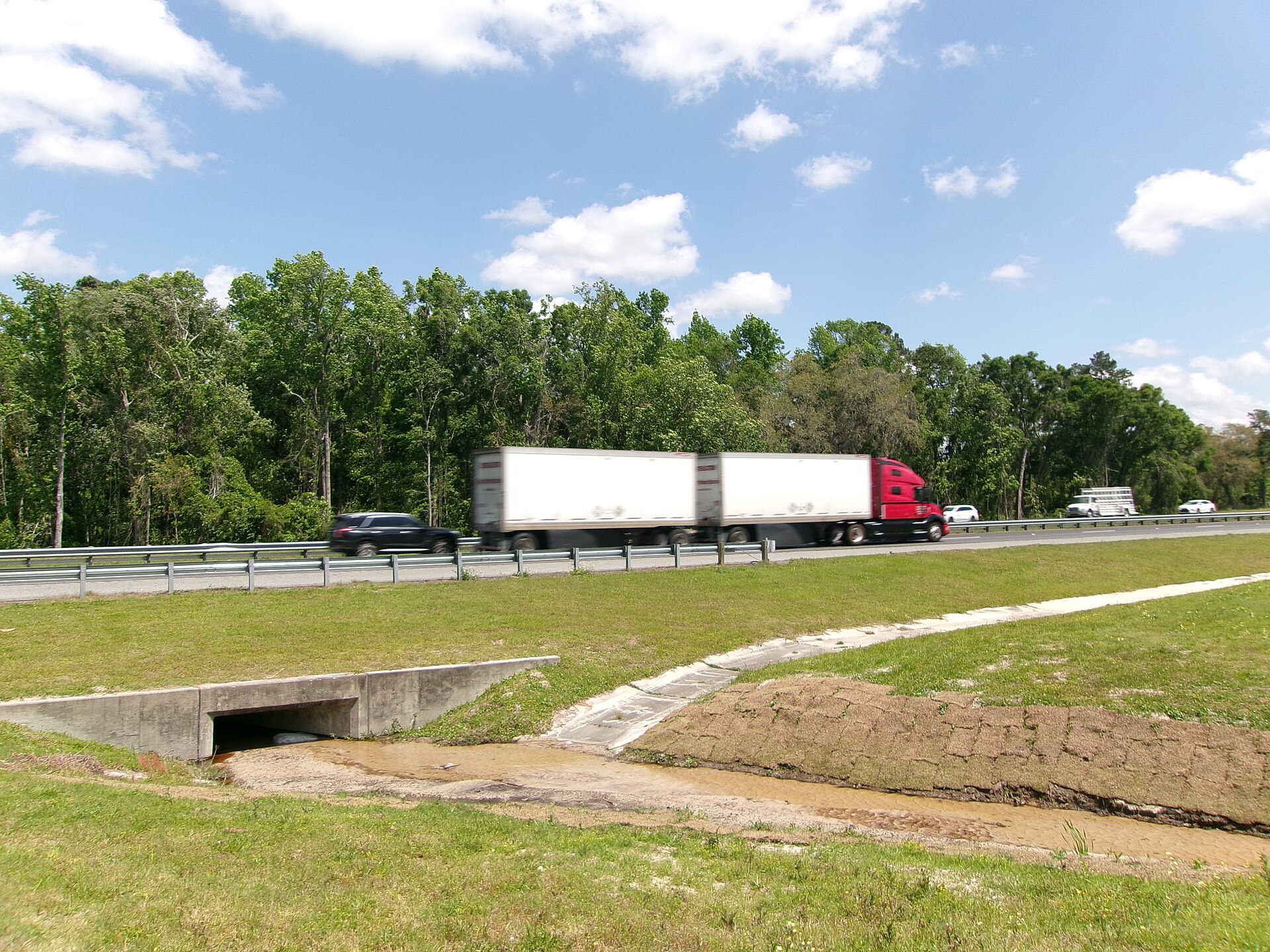 Tractor-trailer driving on an interstate highway