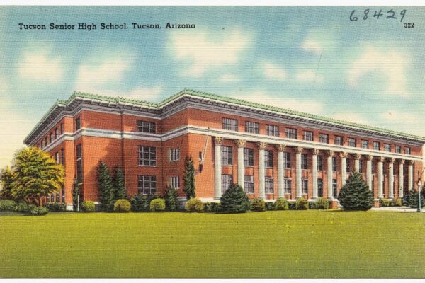 Vintage color postcard of a large red-brick, columned high school building in Tucson