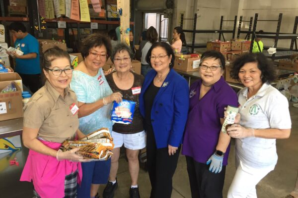 Food bank volunteers sorting donations